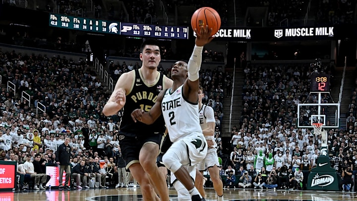 Jan 16, 2023; East Lansing, Michigan, USA; Michigan State Spartans guard Tyson Walker (2) drives past Purdue Boilermakers center Zach Edey (15) during the second half at Jack Breslin Student Events Center. Mandatory Credit: Dale Young-USA TODAY Sports