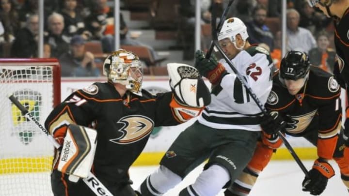 October 17, 2014; Anaheim, CA, USA; Anaheim Ducks goalie Frederik Andersen (31) blocks a shot as center Ryan Kesler (17) helps defend Minnesota Wild right wing Nino Niederreiter (22) during the first period at Honda Center. Mandatory Credit: Gary A. Vasquez-USA TODAY Sports