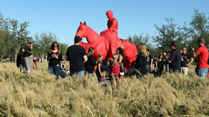 Oct 22, 2016; Lubbock, TX, USA; Texas Tech Red Raiders fans gather at the Will Rogers and Soapsud statue outside of Jones AT&T Stadium before the game with the Oklahoma Sooners. Mandatory Credit: Michael C. Johnson-USA TODAY Sports