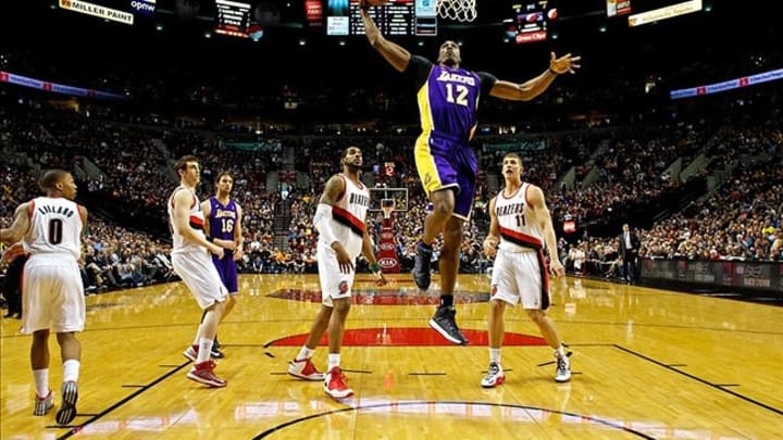 Apr 10, 2013; Portland, OR, USA; Los Angeles Lakers center Dwight Howard (12) dunks Portland Trail Blazers at the Rose Garden. Mandatory Credit: Craig Mitchelldyer-USA TODAY Sports