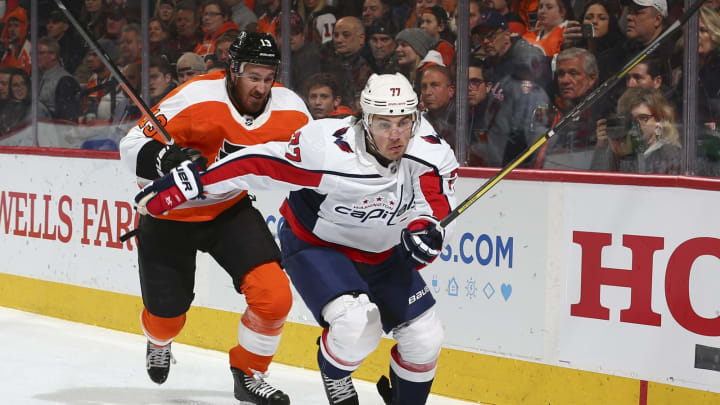 PHILADELPHIA, PA – JANUARY 08: T.J. Oshie #77 of the Washington Capitals and Kevin Hayes #13 of the Philadelphia Flyers skate after the puck in the first period at the Wells Fargo Center on January 8, 2020 in Philadelphia, Pennsylvania. (Photo by Mitchell Leff/Getty Images)