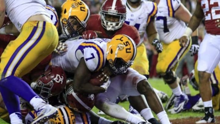 Nov 7, 2015; Tuscaloosa, AL, USA; LSU Tigers running back Leonard Fournette (7) scores a touchdown during the fourth quarter against the Alabama Crimson Tide at Bryant-Denny Stadium. Alabama won 30-16. Mandatory Credit: Marvin Gentry-USA TODAY Sports