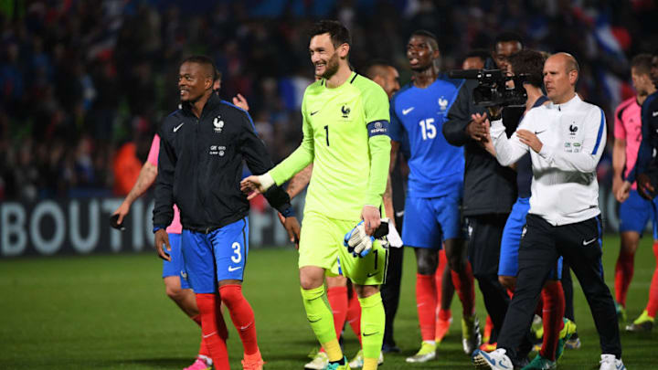 (R-L) Hugo Lloris of France and Patrice Evra of France after the international friendly match between France and Scotland at Stade Saint-Symphorien on June 4, 2016 in Metz, France. (Photo by Dave Winter/Icon Sport) (Photo by Dave Winter/Icon Sport via Getty Images)