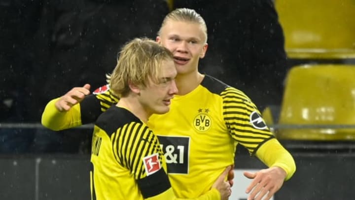 Julian Brandt and Erling Haaland. (Photo by INA FASSBENDER/AFP via Getty Images)