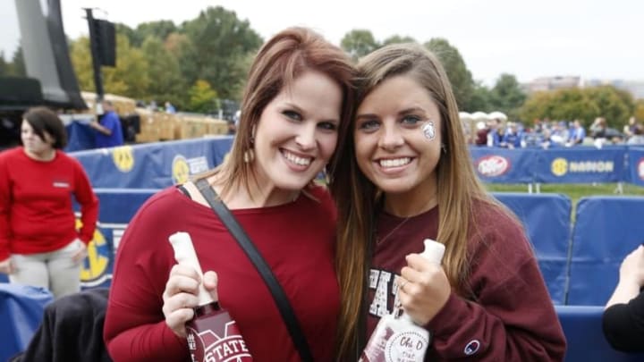 Oct 25, 2014; Lexington, KY, USA; Shelby Howell and Ashley Camp (r) pose with cowbells during the SEC Nation show before the game against the Kentucky Wildcats at Commonwealth Stadium. Mandatory Credit: Mark Zerof-USA TODAY Sports