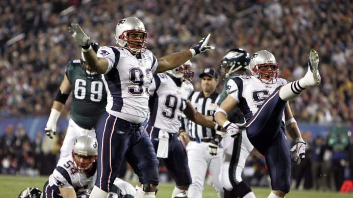 Feb 06, 2005; Jacksonville, FL, USA; New England Patriots defensive end Richard Seymour (93) and Mike Vrabel (50) react against the Philadelphia Eagles during Super Bowl XXXIX at Alltel Stadium. The Patriots defeated the Eagles 24-21. Mandatory Credit: USA TODAY Sports