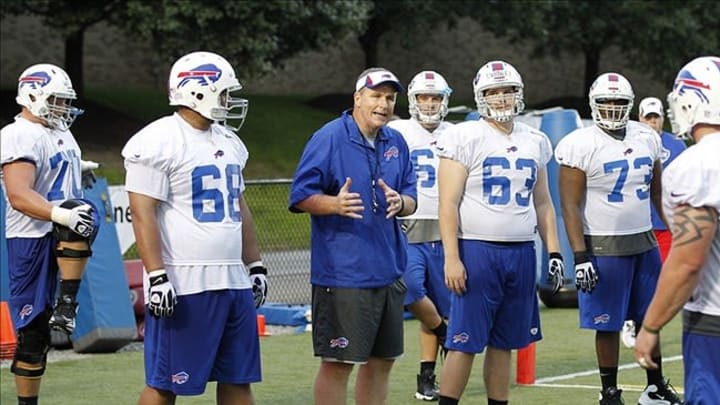 Jul 28, 2013; Pittsford, NY, USA; Buffalo Bills head coach Doug Marrone working with the offensive line during training camp at St. John Fisher College. Mandatory Credit: Kevin Hoffman-USA TODAY Sports