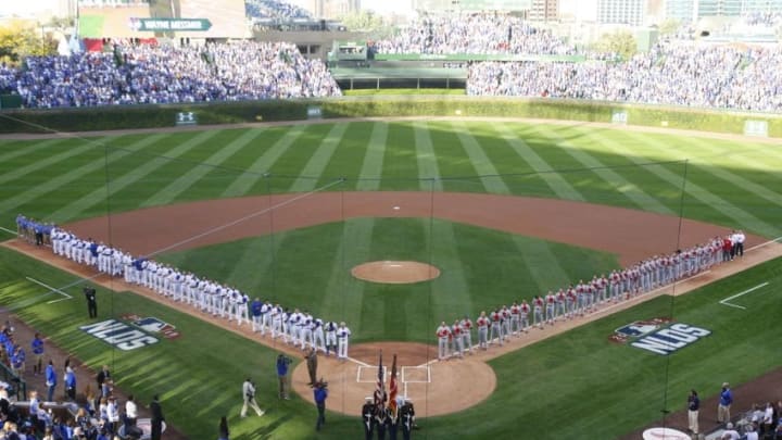 Oct 12, 2015; Chicago, IL, USA; The Chicago Cubs and St. Louis Cardinals on the field during the national anthem before game three of the NLDS at Wrigley Field. Mandatory Credit: Caylor Arnold-USA TODAY Sports