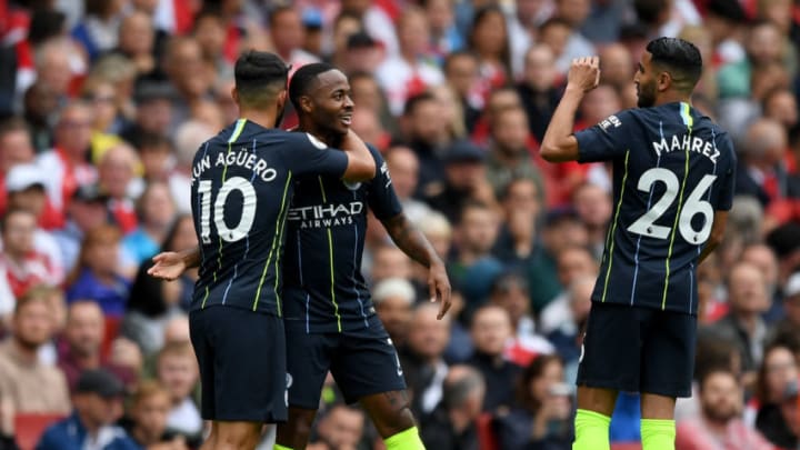 LONDON, ENGLAND - AUGUST 12: Raheem Sterling of Manchester City celebrates after scoring his team's first goal with Sergio Aguero and Riyad Mahrez during the Premier League match between Arsenal FC and Manchester City at Emirates Stadium on August 12, 2018 in London, United Kingdom. (Photo by Shaun Botterill/Getty Images)