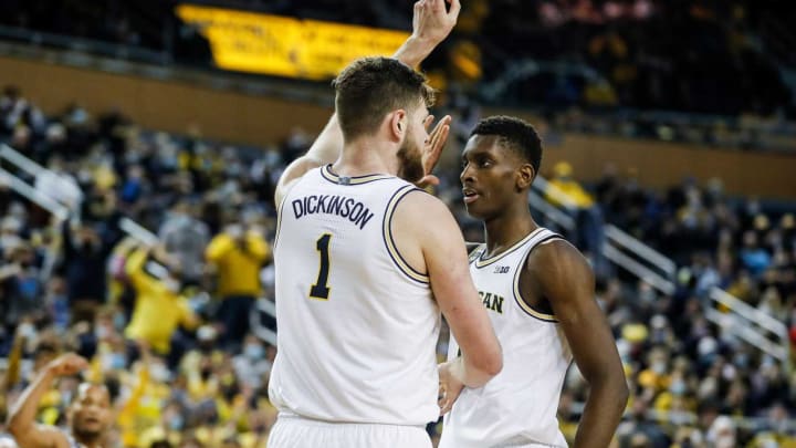 Michigan center Hunter Dickinson (1) and forward Moussa Diabate (14) celebrate a play against Iowa during the second half at the Crisler Center in Ann Arbor on Thursday, March 3, 2022.