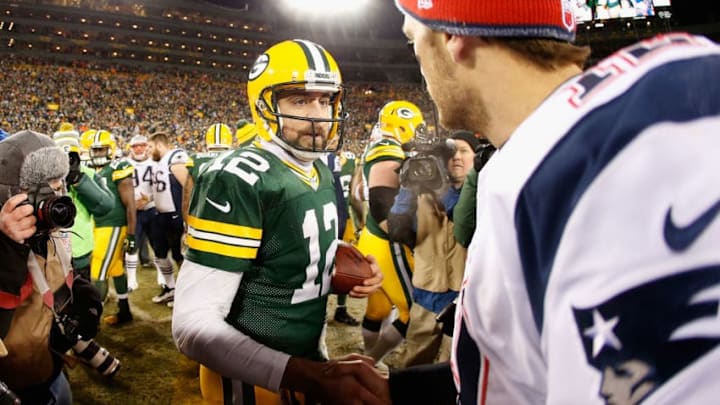 GREEN BAY, WI - NOVEMBER 30: Quarterbacks Aaron Rodgers #12 of the Green Bay Packers and Tom Brady #12 of the New England Patriots shake hands following the NFL game at Lambeau Field on November 30, 2014 in Green Bay, Wisconsin. The Packers defeated the Patriots 26-21. (Photo by Christian Petersen/Getty Images)