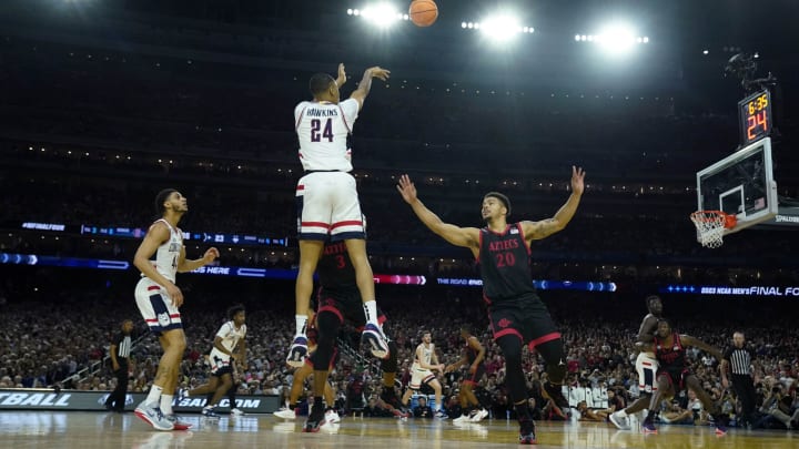 Apr 3, 2023; Houston, TX, USA; Connecticut Huskies guard Jordan Hawkins (24) shoots the ball over San Diego State Aztecs guard Matt Bradley (20) during the first half in the national championship game of the 2023 NCAA Tournament at NRG Stadium. Mandatory Credit: Bob Donnan-USA TODAY Sports
