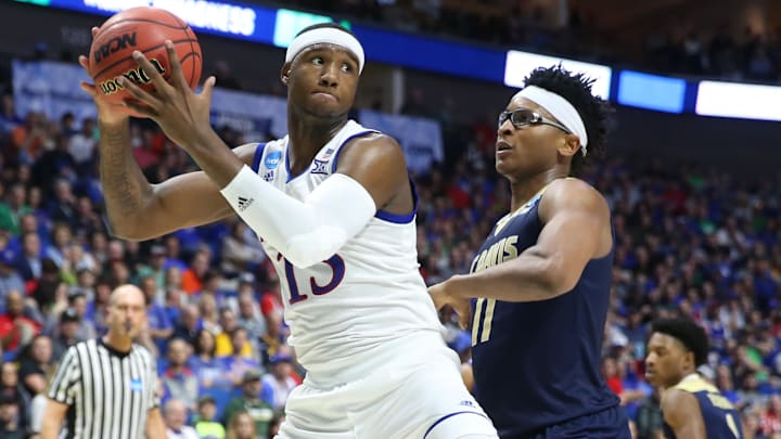 Mar 17, 2017; Tulsa, OK, USA; Kansas Jayhawks forward Carlton Bragg Jr. (15) works around UC Davis Aggies forward Chima Moneke (11) during the second half in the first round of the 2017 NCAA Tournament at BOK Center. Mandatory Credit: Kevin Jairaj-USA TODAY Sports