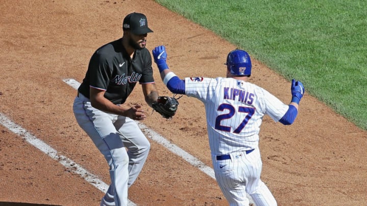 CHICAGO, ILLINOIS - SEPTEMBER 30: Sandy Alcantara #22 of the Miami Marlins readies to tag Jason Kipnis #27 of the Chicago Cubsin the first base line in the 5th inning during Game One of the National League Wild Card Series at Wrigley Field on September 30, 2020 in Chicago, Illinois. (Photo by Jonathan Daniel/Getty Images)