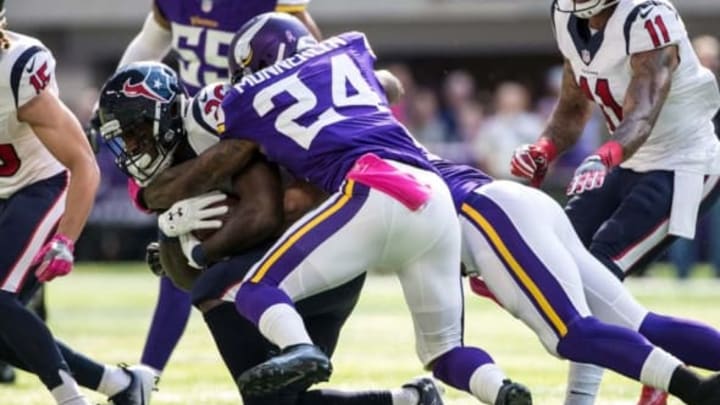 Oct 9, 2016; Minneapolis, MN, USA; Houston Texans running back Lamar Miller (26) is tackled by Minnesota Vikings cornerback Captain Munnerlyn (24) during the first quarter at U.S. Bank Stadium. Mandatory Credit: Brace Hemmelgarn-USA TODAY Sports