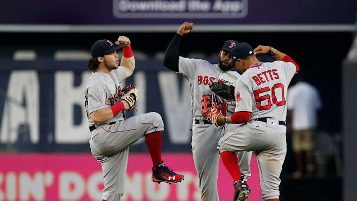 NEW YORK, NY - AUGUST 12: Outfielders Andrew Benintendi #16, Jackie Bradley Jr. #19 and Mookie Betts #50 of the Boston Red Sox celebrate after they defeat the New York Yankees 10-5 during a game at Yankee Stadium on August 12, 2017 in the Bronx borough of New York City. (Photo by Rich Schultz/Getty Images)