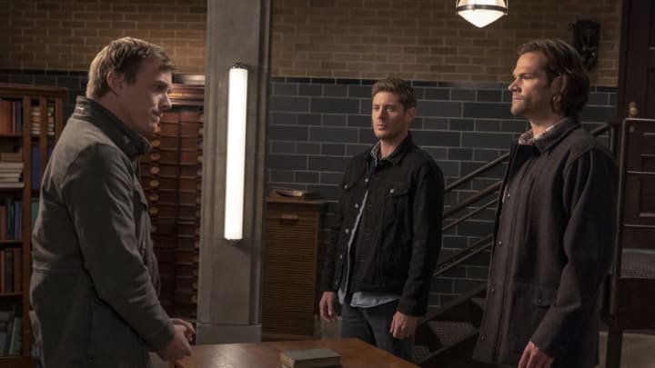 Supernatural — “Our Father, Who Aren’t in Heaven” — Image Number: SN1508A_0121b.jpg — Pictured (L-R): Jake Abel as Adam/Michael, Jensen Ackles as Dean and Jared Padalecki as Sam — Photo: Colin Bentley/The CW — © 2019 The CW Network, LLC. All Rights Reserved.