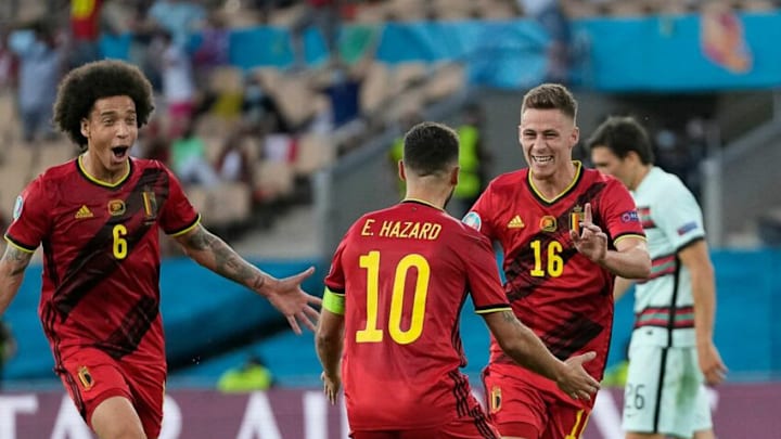 Thorgan Hazard (R) celebrates his goal for Belgium (Photo by THANASSIS STAVRAKIS/POOL/AFP via Getty Images)