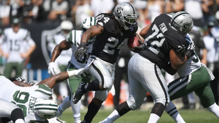OAKLAND, CA - SEPTEMBER 17: Marshawn Lynch #24 of the Oakland Raiders breaks a tackle and rushes for a thirteen yard gain against the New York Jets during the first quarter of their NFL football game at Oakland-Alameda County Coliseum on September 17, 2017 in Oakland, California. (Photo by Thearon W. Henderson/Getty Images)