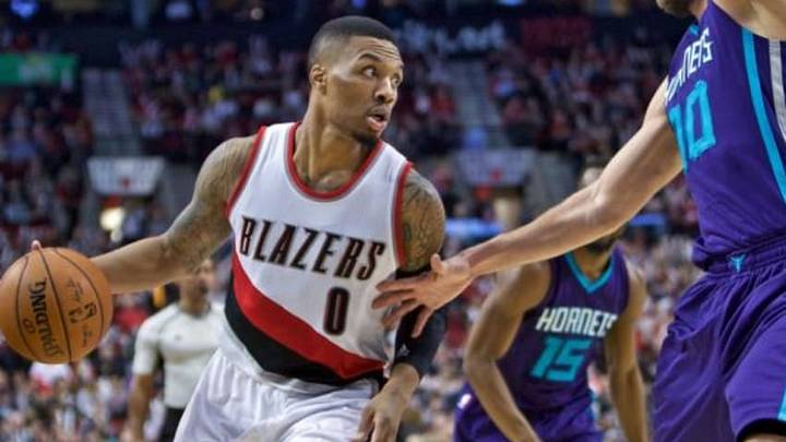 Jan 29, 2016; Portland, OR, USA; Portland Trail Blazers guard Damian Lillard (0) drives to the basket against the Charlotte Hornets during the third quarter at the Moda Center. Mandatory Credit: Craig Mitchelldyer-USA TODAY Sports