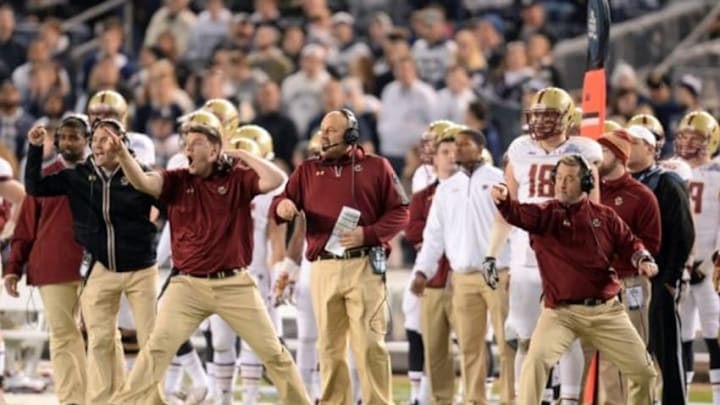Dec 27, 2014; Bronx, NY, USA; Boston College Eagles coaches shout against the Penn State Nittany Lions during the first half of the 2014 Pinstripe Bowl at Yankee Stadium. Mandatory Credit: Joe Camporeale-USA TODAY Sports