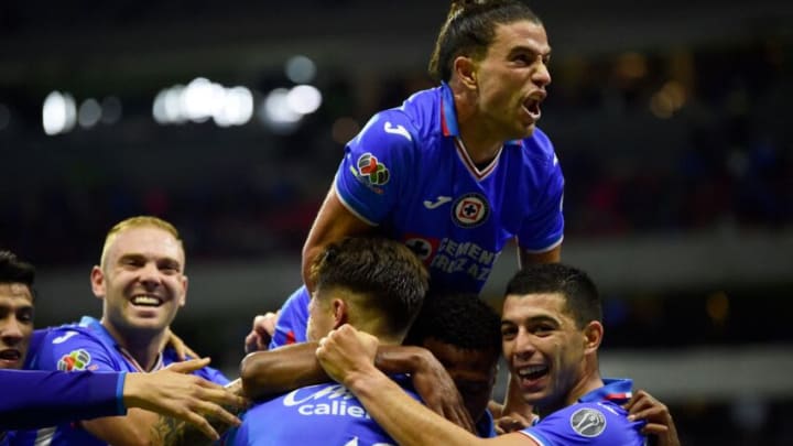 Cruz Azul players celebrate after Miguel Estrada knocked home the game-winning goal against Guadalajara. (Photo by CLAUDIO CRUZ/AFP via Getty Images)