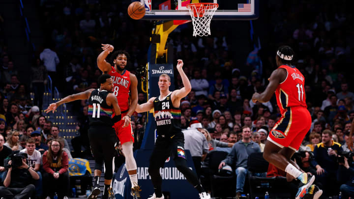 Then-New Orleans Pelicans center Jahlil Okafor (8) passes the ball to guard Jrue Holiday (11) as Denver Nuggets guard Monte Morris (11) and forward Mason Plumlee (24) defend. Mandatory Credit: Isaiah J. Downing-USA TODAY Sports