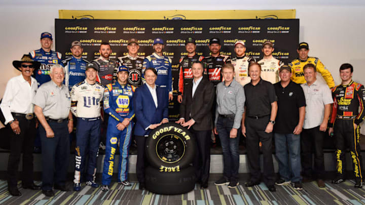 HOMESTEAD, FL - NOVEMBER 18: NASCAR President Brent Dewar and Goodyear President and CEO Rich Kramer pose with current and former drivers after a press conference announcing the renewal of the partnership between NASCAR and Goodyear at Homestead-Miami Speedway on November 18, 2017 in Homestead, Florida. (Photo by Jared C. Tilton/Getty Images)