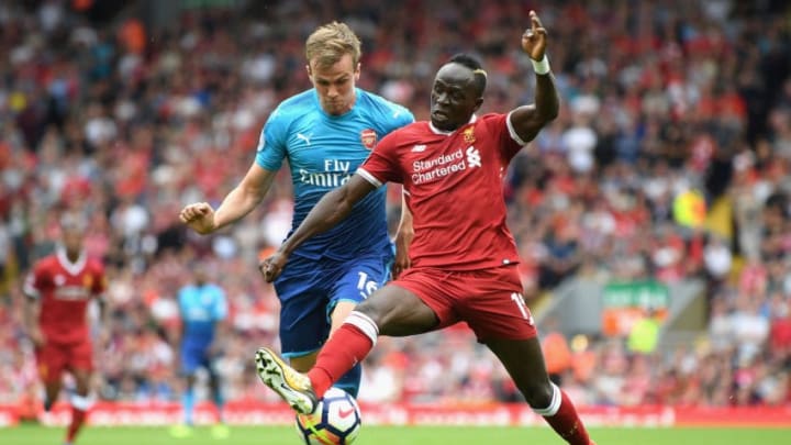 LIVERPOOL, ENGLAND - AUGUST 27: Rob Holding of Arsenal and Sadio Mane of Liverpool battle for possession during the Premier League match between Liverpool and Arsenal at Anfield on August 27, 2017 in Liverpool, England. (Photo by Michael Regan/Getty Images)