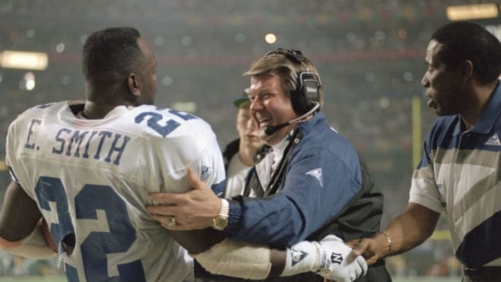 ATLANTA, GA – JANUARY 30: Head Coach Jimmy Johnson and Emmitt Smith #22 of the Dallas Cowboys celebrates as the Cowboys leads the Buffalo Bills late in the fourth quarter of Super Bowl XXVIII on January 30, 1994 at the Georgia Dome in Atlanta, Georgia. The Cowboys won the Super Bowl 30 -13. (Photo by Focus on Sport/Getty Images)