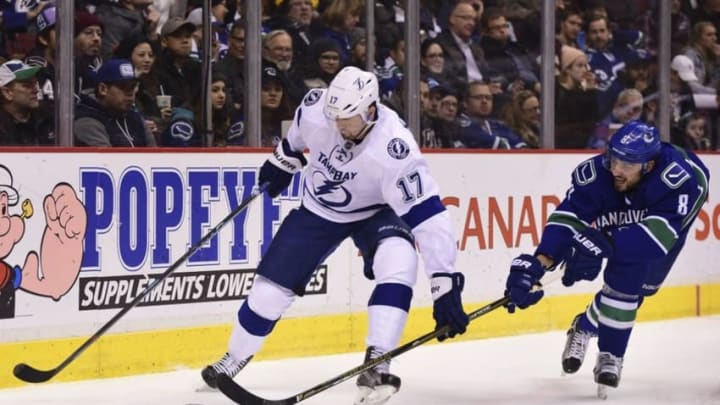 Dec 16, 2016; Vancouver, British Columbia, CAN; Vancouver Canucks defenseman Christopher Tanev (8) reaches across Tampa Bay Lightning forward Alex Killorn (17) during the second period at Rogers Arena. Mandatory Credit: Anne-Marie Sorvin-USA TODAY Sports