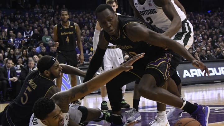 ROSEMONT, IL – FEBRUARY 17: Dererk Pardon #5 of the Northwestern Wildcats Scottie Lindsey #20 of the Northwestern Wildcats and Nick Ward (C) of the Michigan State Spartans go for a loose ball during the first half on February 17, 2018 at Allstate Arena in Rosemont, Illinois. (Photo by David Banks/Getty Images)