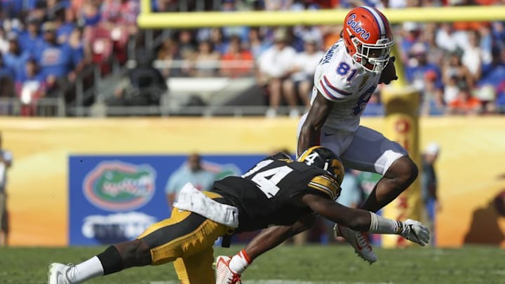 Jan 2, 2017; Tampa , FL, USA; Florida Gators wide receiver Antonio Callaway (81) carries the ball as Iowa Hawkeyes defensive back Desmond King (14) defends at Raymond James Stadium. Mandatory Credit: Logan Bowles-USA TODAY Sports