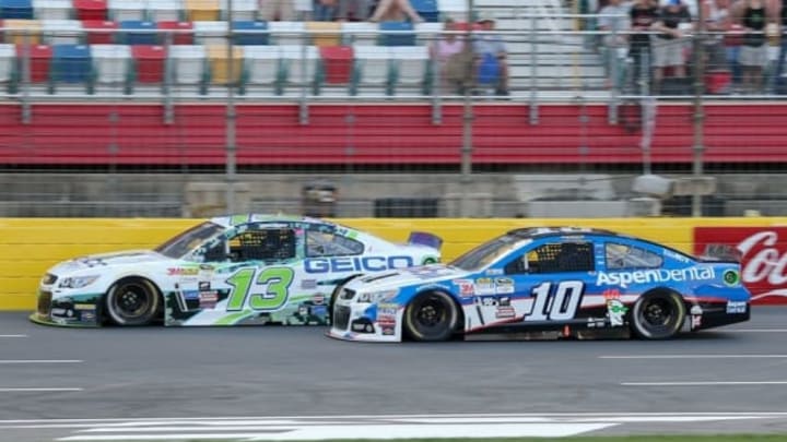 May 15, 2015; Concord, NC, USA; NASCAR Sprint Cup Series driver Casey Mears (13) and Sprint Cup Series driver Danica Patrick (10) race during the Sprint Showdown at Charlotte Motor Speedway. Mandatory Credit: Randy Sartin-USA TODAY Sports