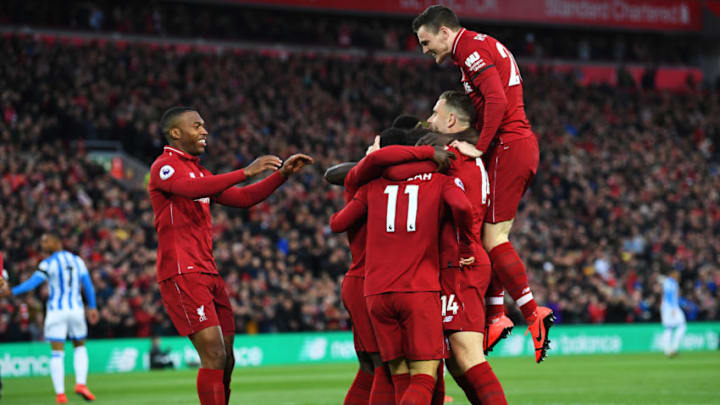 LIVERPOOL, ENGLAND - APRIL 26: Naby Keita of Liverpool (obscured) celebrates after scoring his team's first goal with team mates during the Premier League match between Liverpool FC and Huddersfield Town at Anfield on April 26, 2019 in Liverpool, United Kingdom. (Photo by Michael Regan/Getty Images)