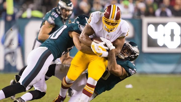 Dec 26, 2015; Philadelphia, PA, USA; Washington Redskins running back Pierre Thomas (39) is tackled by Philadelphia Eagles linebacker Kiko Alonso (50) an dinside linebacker Mychal Kendricks (95) during the second half at Lincoln Financial Field. The Redskins won 38-24. Mandatory Credit: Bill Streicher-USA TODAY Sports