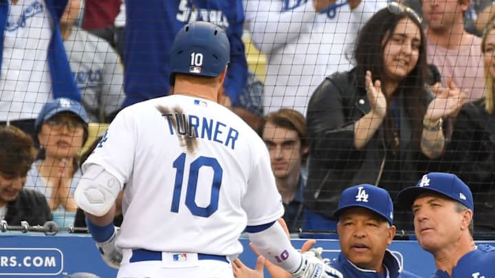 LOS ANGELES, CA - MAY 11: Justin Turner #10 is greeted at the dugout by manager Dave Roberts #30 of the Los Angeles Dodgers after hitting a two run home run in the third inning of the game against the Washington Nationals at Dodger Stadium on May 11, 2019 in Los Angeles, California. (Photo by Jayne Kamin-Oncea/Getty Images)