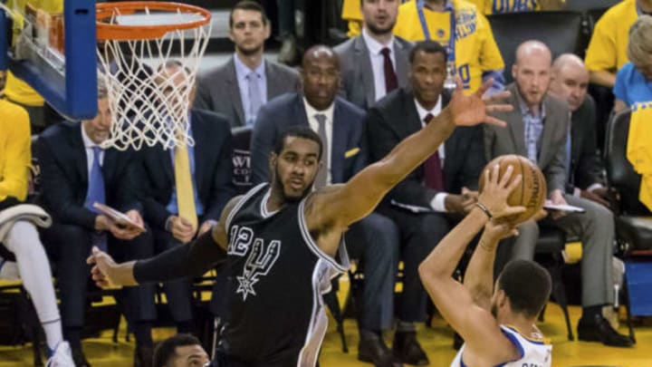 May 16, 2017; Oakland, CA, USA; San Antonio Spurs forward LaMarcus Aldridge (12) defends the shot by Golden State Warriors guard Stephen Curry (30) during the third quarter in game two of the Western conference finals of the NBA Playoffs at Oracle Arena. Mandatory Credit: Kelley L Cox-USA TODAY Sports
