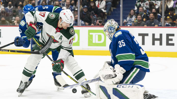 VANCOUVER, BC – OCTOBER 26: Marcus Foligno #17 of the Minnesota Wild shoots against goalie Thatcher Demko #35 of the Vancouver Canucks during the first period of NHL action on October, 26, 2021 at Rogers Arena in Vancouver, British Columbia, Canada. (Photo by Rich Lam/Getty Images)