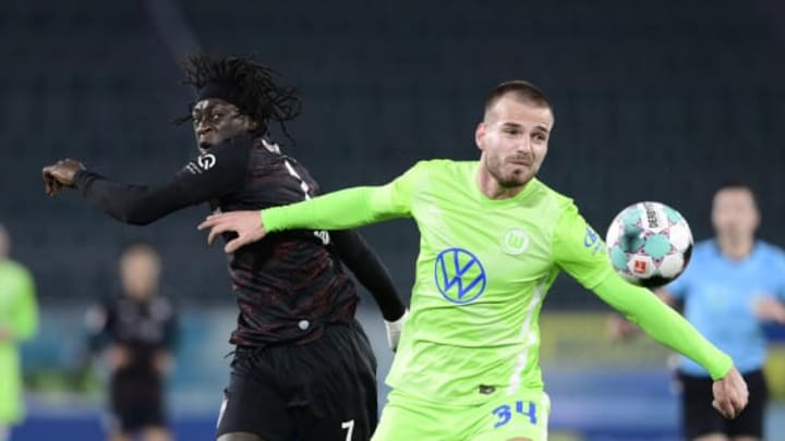WOLFSBURG, GERMANY – DECEMBER 20: Tanguy Coulibaly of VfB Stuttgart battles for possession with Marin Pongracic of VfL Wolfsburg during the Bundesliga match between VfL Wolfsburg and VfB Stuttgart at Volkswagen Arena on December 20, 2020 in Wolfsburg, Germany. Sporting stadiums around Germany remain under strict restrictions due to the Coronavirus Pandemic as Government social distancing laws prohibit fans inside venues resulting in games being played behind closed doors. (Photo by Oliver Hardt/Getty Images)