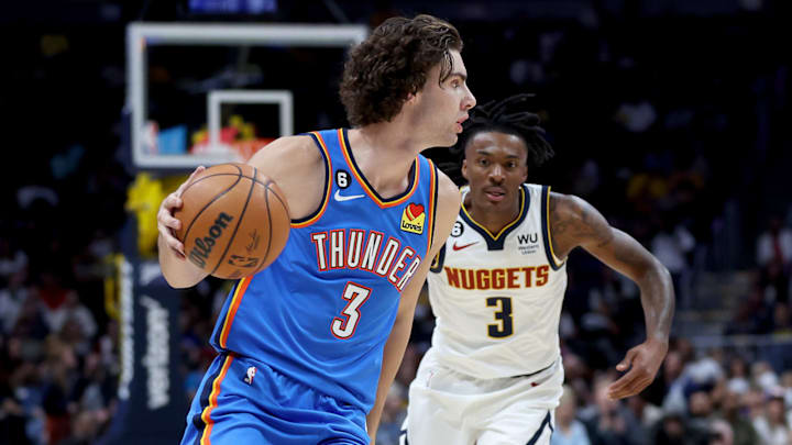 DENVER, COLORADO – OCTOBER 03: Josh Giddey #3 of the Oklahoma City Thunder looks for an opening against the Denver Nuggets in the second period during a pre-season game at Ball Arena on October 3, 2022 in Denver, Colorado. (Photo by Matthew Stockman/Getty Images)