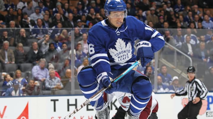 TORONTO, ON - JANUARY 14: Mitchell Marner #16 of the Toronto Maple Leafs jumps to get out of the way of a puck against the Colorado Avalanche during an NHL game at Scotiabank Arena on January 14, 2019 in Toronto, Ontario, Canada. The Avalanche defeated the Maple Leafs 6-3. (Photo by Claus Andersen/Getty Images)