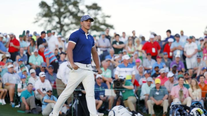 AUGUSTA, GEORGIA - APRIL 11: Brooks Koepka of the United States reacts to a missed birdie putt on the 18th green during the first round of the Masters at Augusta National Golf Club on April 11, 2019 in Augusta, Georgia. (Photo by Kevin C. Cox/Getty Images)
