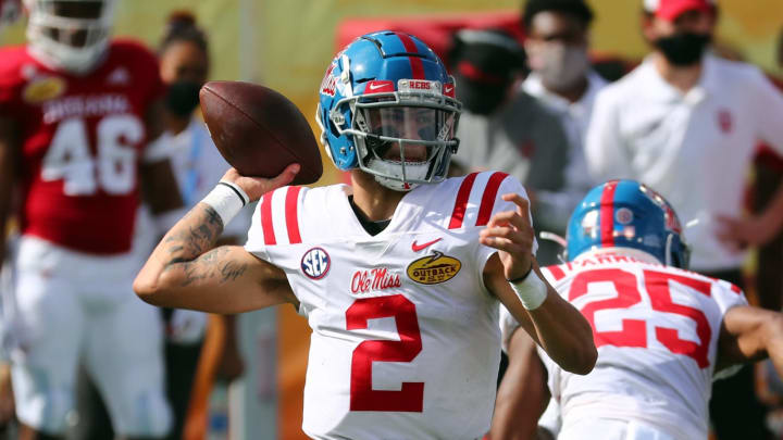 Jan 2, 2021; Tampa, FL, USA; Mississippi Rebels quarterback Matt Corral (2) throws the ball during the first quarter against the Indiana Hoosiers at Raymond James Stadium. Mandatory Credit: Kim Klement-USA TODAY Sports