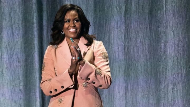 Former US first lady Michelle Obama gestures on stage of the Royal Arena in Copenhagen on April 9, 2019 during a tour to promote her memoir "Becoming". (Photo by Martin Sylvest / Ritzau Scanpix / AFP) / Denmark OUT (Photo by MARTIN SYLVEST/Ritzau Scanpix/AFP via Getty Images)