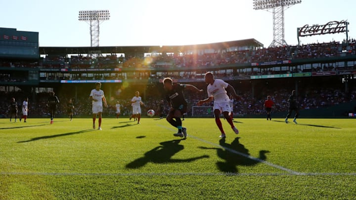 BOSTON, MASSACHUSETTS - JULY 21: Alex Oxlade-Chamberlain of Liverpool battles for the ball against Sevilla in the first half of a pre-season friendly at Fenway Park on July 21, 2019 in Boston, Massachusetts. (Photo by Tim Bradbury/Getty Images)