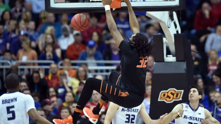 Mar 9, 2016; Kansas City, MO, USA; Oklahoma State Cowboys forward Anthony Allen Jr. (32) dunks the ball in the second half against the Kansas State Wildcats during the Big 12 Conference tournament at Sprint Center. The Wildcats won 75-71. Mandatory Credit: Denny Medley-USA TODAY Sports