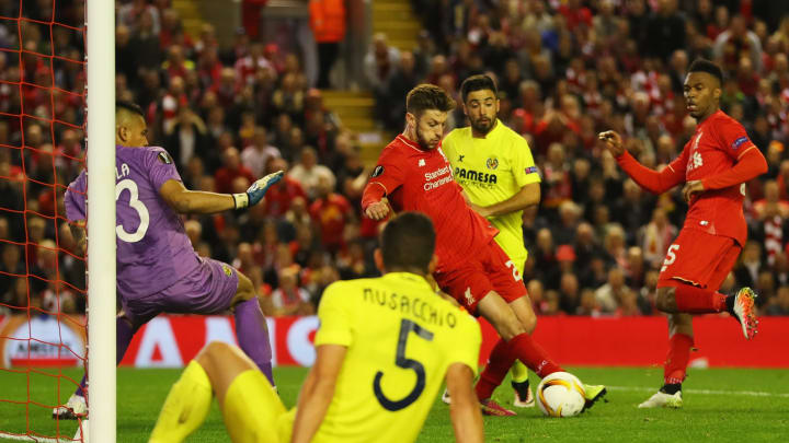 LIVERPOOL, UNITED KINGDOM – MAY 05: Adam Lallana of Liverpool (C) scores their third goal past goalkeeper Alphonse Areola of Villarreal during the UEFA Europa League semi final second leg match between Liverpool and Villarreal CF at Anfield on May 5, 2016 in Liverpool, England. (Photo by Richard Heathcote/Getty Images)