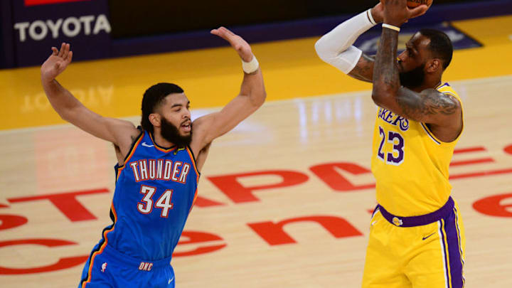 Feb 10, 2021; Los Angeles, California, USA; Los Angeles Lakers forward LeBron James (23) shoots against Oklahoma City Thunder guard Kenrich Williams (34) during the first half at Staples Center. Mandatory Credit: Gary A. Vasquez-USA TODAY Sports