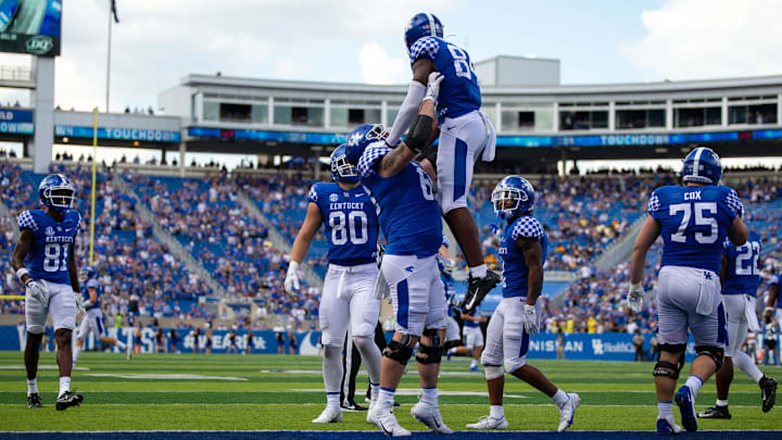 Sep 18, 2021; Lexington, Kentucky, USA; Kentucky Wildcats players celebrate a touchdown by wide receiver Izayah Cummings (84) during the fourth quarter against the Chattanooga Mocs at Kroger Field. Mandatory Credit: Jordan Prather-USA TODAY Sports